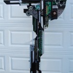Ronald Nigro, 
Trafford<br>
<b>Out of the Black</b><br>
mixed media sculpture<br>
76" x 39" x 24"<br>
